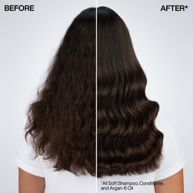 Redken All Soft Conditioner 495g in a bathroom setting with hair care products
