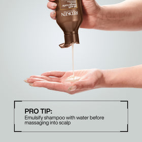 Redken All Soft Mega Curls Shampoo in bathroom setting