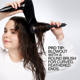 Redken Big Blowout Heat Protectant Gel lifestyle scene showing bouncy hair