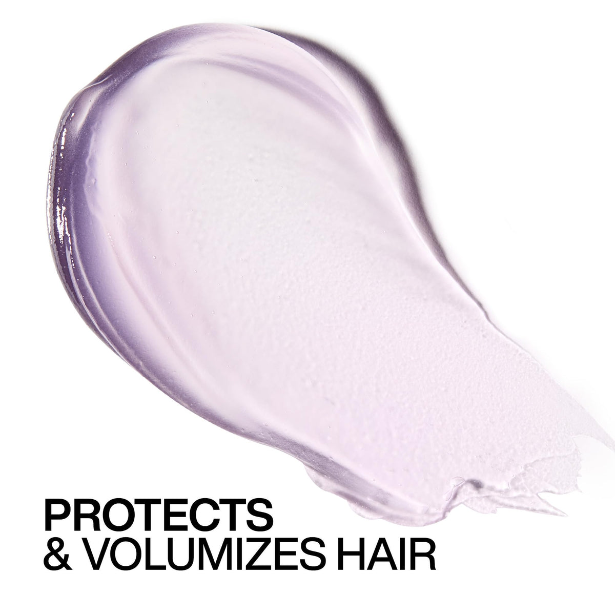 Redken Big Blowout Heat Protectant Gel on a vanity with styling tools