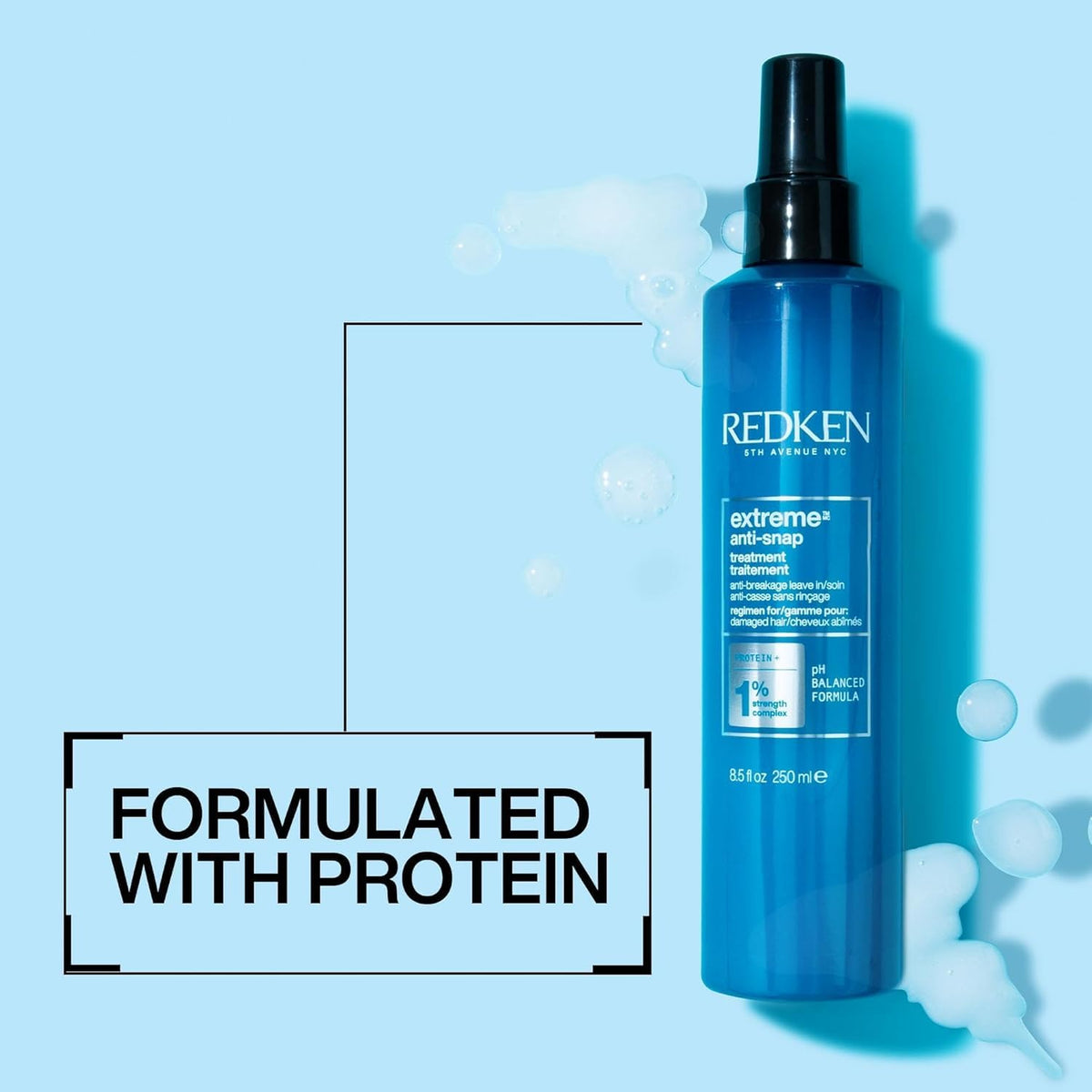 Redken Extreme Anti-Snap Leave-In Conditioner application on hair