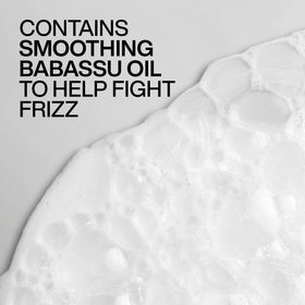 Redken Frizz Dismiss Conditioner on vanity
