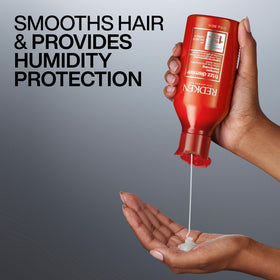 Redken Frizz Dismiss Shampoo 33.8 Fl Oz in bathroom setting
