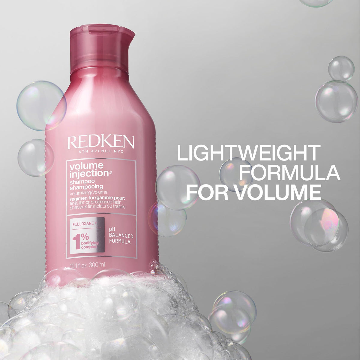 Redken Volume Injection Shampoo on a bathroom shelf