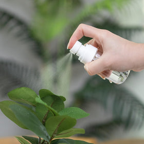 RELANOR mini spray bottles in a travel bag