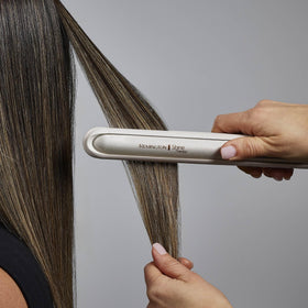 Remington Shine Therapy straightener on a vanity