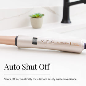 Remington Shine Therapy Tapered Curling Wand in use with curls