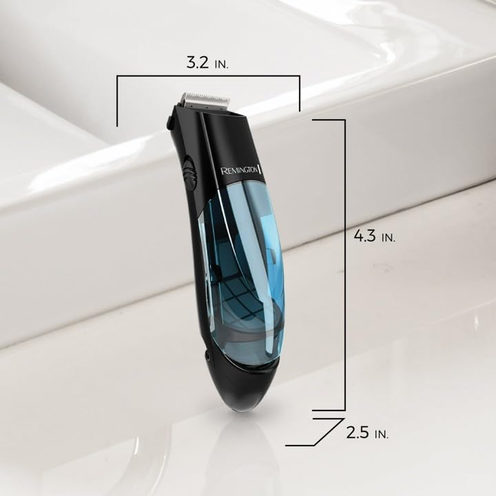 Remington Vacuum Hair Clippers 18-piece kit on a grooming table with accessories