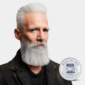 REUZEL Clay Matte Pomade 109g on a grooming table
