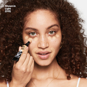 REVLON ColorStay Skin Awaken Concealer 015 Light displayed with makeup tools