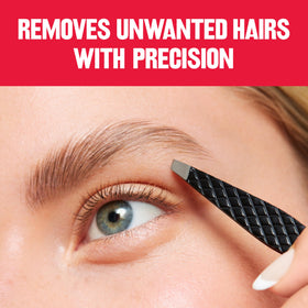 REVLON Expert Slant Tweezer in hand for precise use