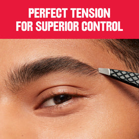 REVLON Expert Slant Tweezer on a bathroom counter