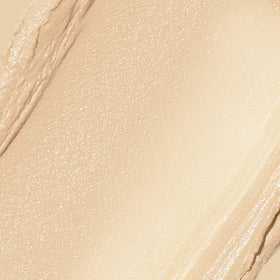 REVLON Glimmer Tinted Moisturizer Stick 100 Fair on a makeup table