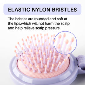 RHOS Hair Brush with Mirror being held in hand