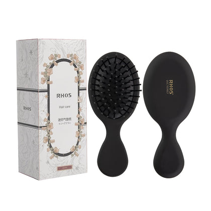 RHOS Mini Hair Brush black model front view with soft bristles