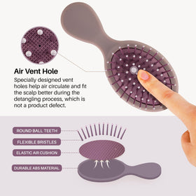 RHOS Mini Hair Brush held in hand for size reference