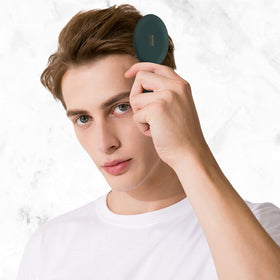 RHOS Mini Hair Brush showing ergonomic handle design