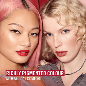 Rimmel Lasting Finish Lipstick displayed on a vanity