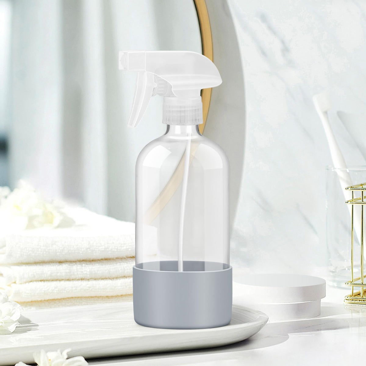 Rionisor glass spray bottle in use for watering plants
