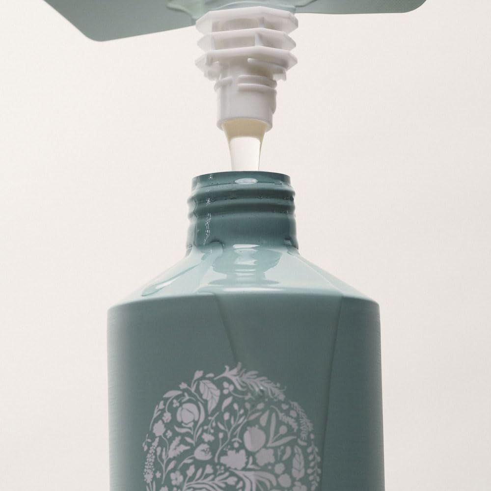 RŌZ Foundation Shampoo Refill being poured into bottle