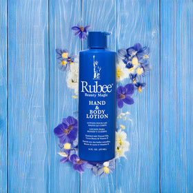 RUBEE Body & Hand Lotion with ingredients on display