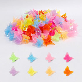 Ruocce butterfly hair clips held in hand for size reference