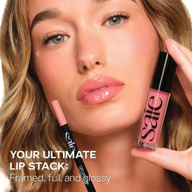Saie Glossybounce Hydrating Lip Gloss lifestyle shot in handbag