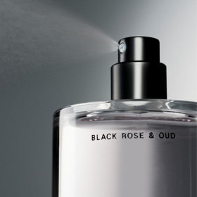 Salt & Stone Hair & Body Mist Black Rose & Oud with floral background