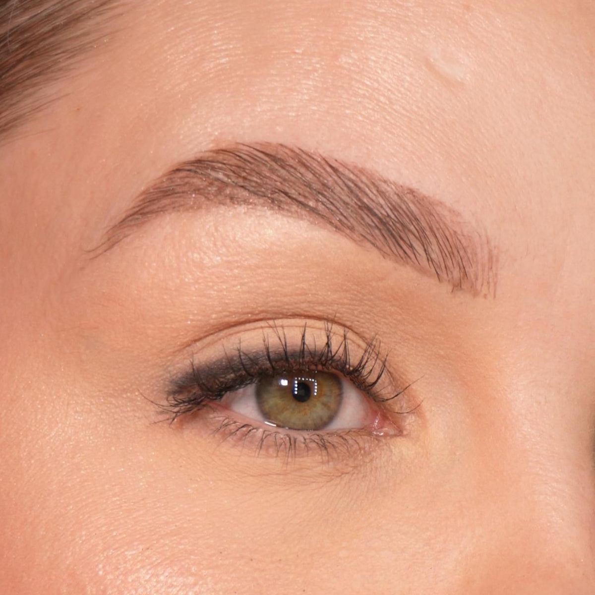 Sandstone Scandinavia Eyeliner Pencil next to other makeup products