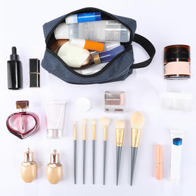 Sanwuta toiletry bag in dark blue on a washstand