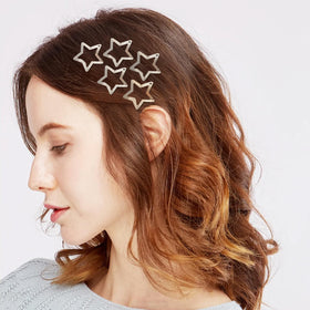 SAOROPEB star hair clips in use at a festival