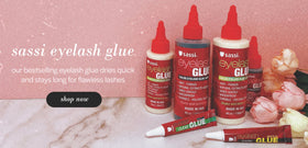 Sassi Eyelash Glue Clear 2oz in lifestyle setting with false eyelashes