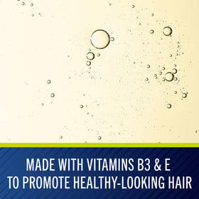Selsun Blue Naturals Itchy Dry Scalp Shampoo in bathroom setting