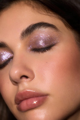 SHEGLAM Crystal Jelly Glaze Stick Eye Shadow Violet Crush blended on skin