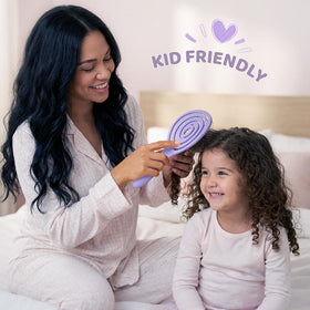 SHINLEA Detangle Hair Brush with a user smiling