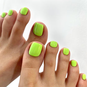 Short square neon toenails on feet for a stylish look