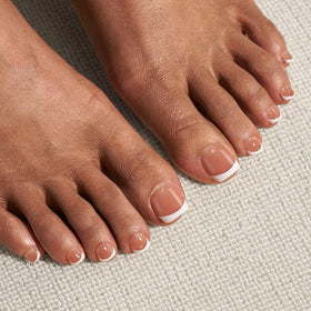 Side view of BTARTBOXNAILS brown squoval press on toenails