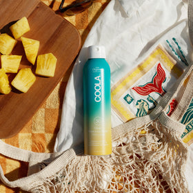 Side view of COOLA Organic Sunscreen SPF 30 Spray bottle