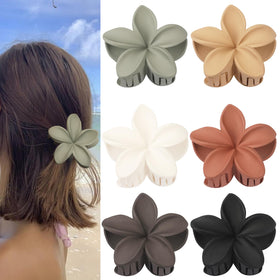 Sisiaipu Flower Claw Clip in Beige Yellow on a table