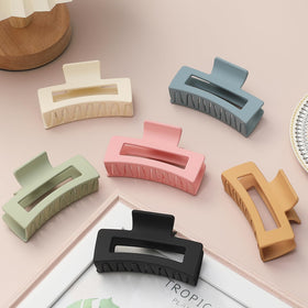 Sisiaipu hair clips in vibrant colours including pink and yellow