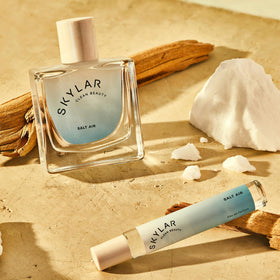 Skylar Salt Air Rollerball Perfume 10mL on a beach background