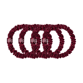 SLIP maroon silk skinny scrunchies styled in hair