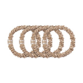 SLIP Silk Skinny Scrunchies laid flat on a surface