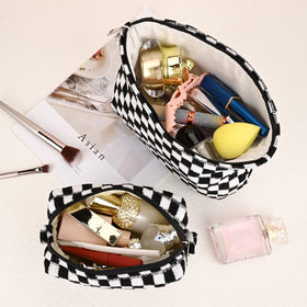 SOIDRAM checkered cosmetic bag open displaying contents