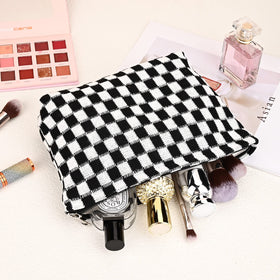 SOIDRAM checkered cosmetic bag with travel essentials inside