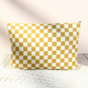 SOIDRAM Checkered Makeup Bag Set lifestyle shot on a travel suitcase