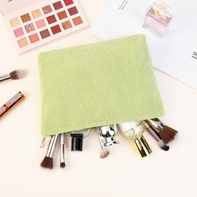 SOIDRAM Corduroy Makeup Bag lifestyle scene with cosmetics