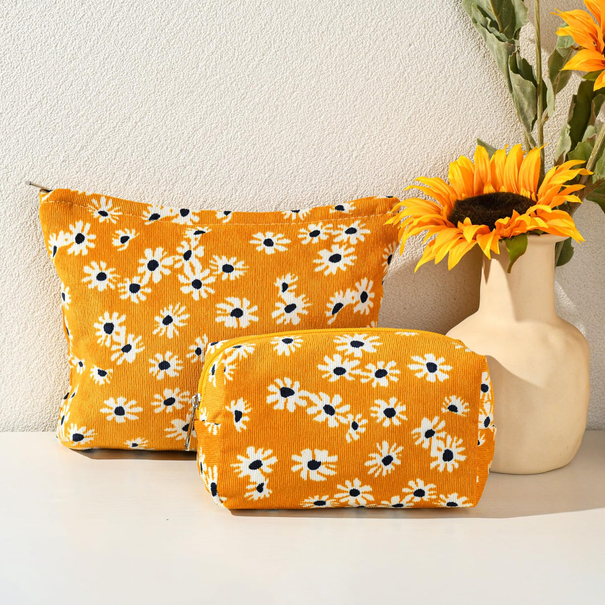 SOIDRAM Flower Makeup Bag Set on a travel suitcase