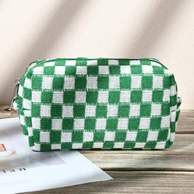 SOIDRAM green checkered makeup bags in lifestyle setting