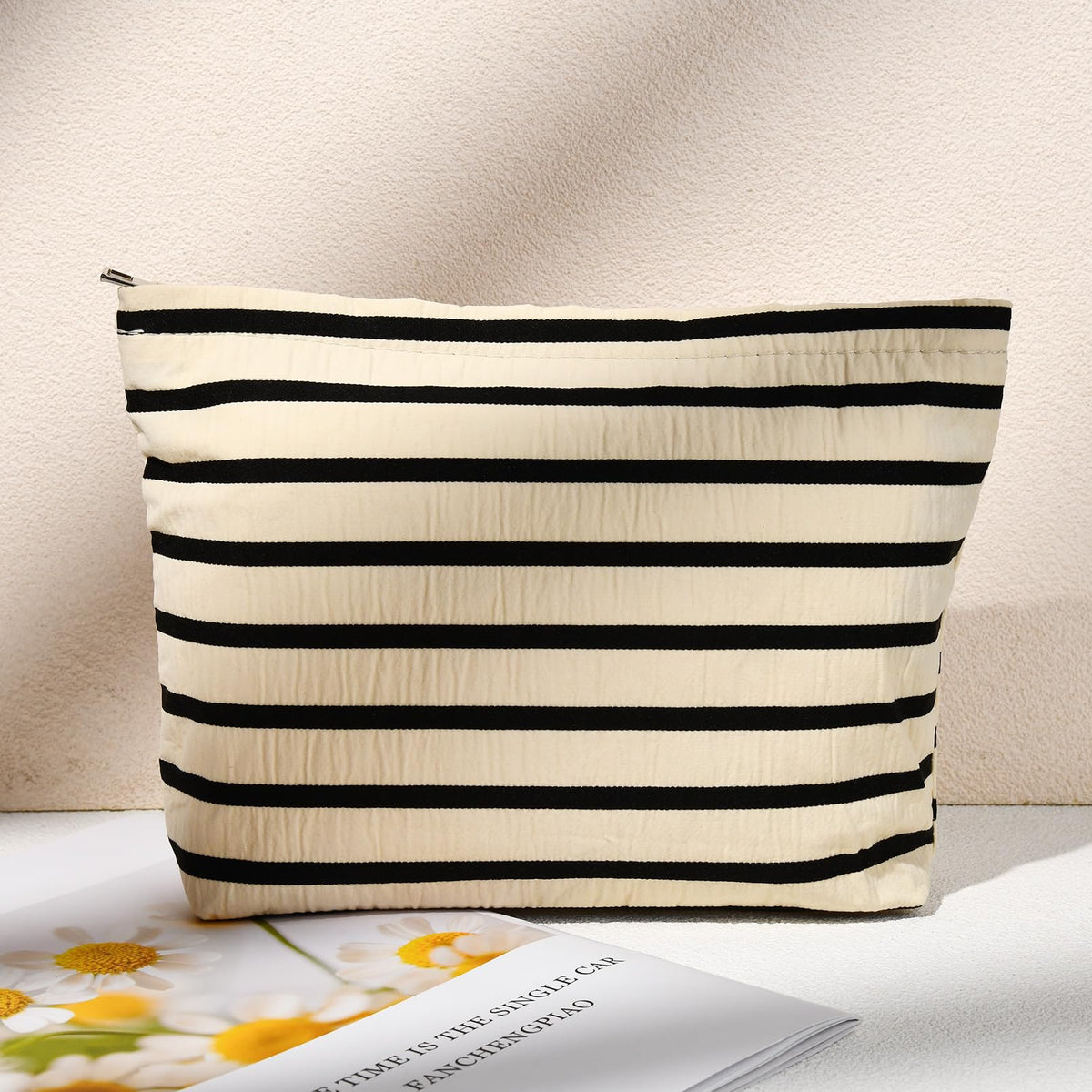 SOIDRAM makeup bag set on a travel suitcase